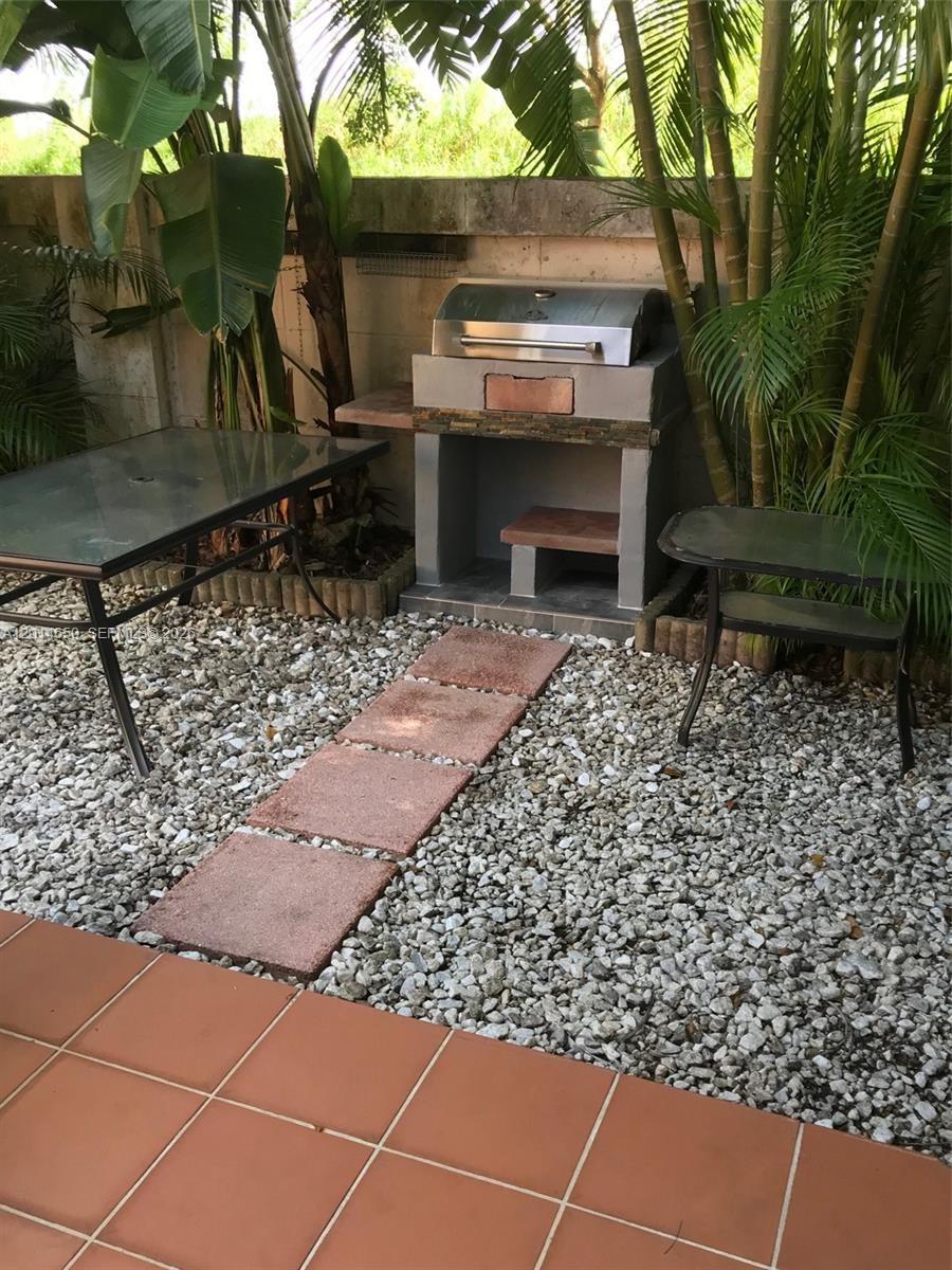 16654 Southwest 103rd Lane Miami, FL 33196 - Photo 18 of 20 a outdoor view of a garden