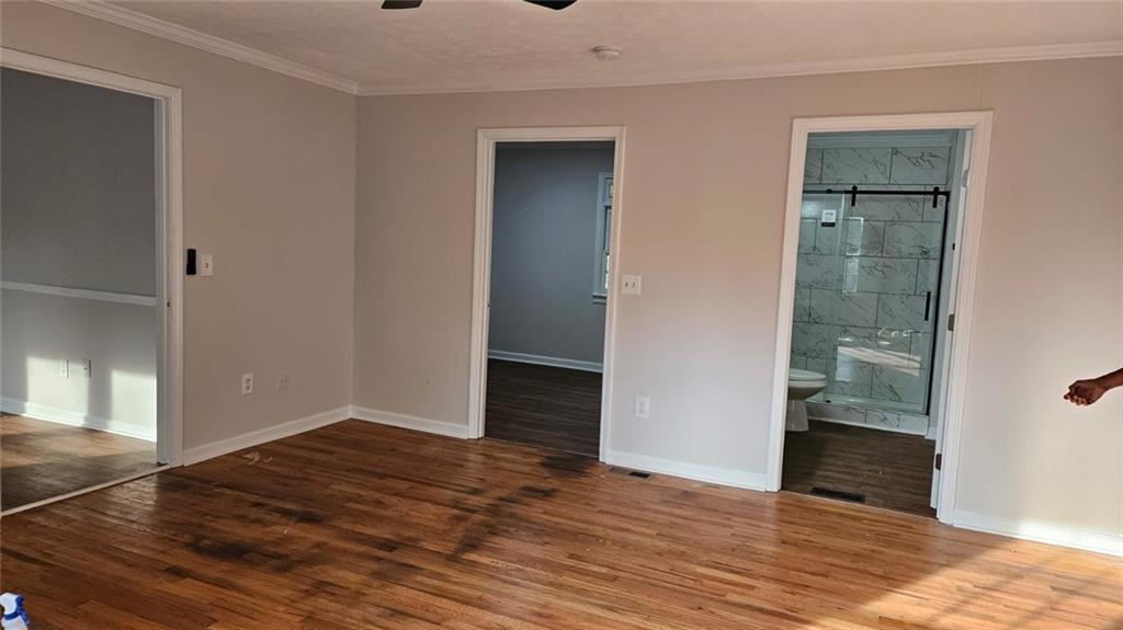 471 Perkins Circle Canton, GA 30115 - Photo 17 of 20 a view of an empty room with wooden floor and a window