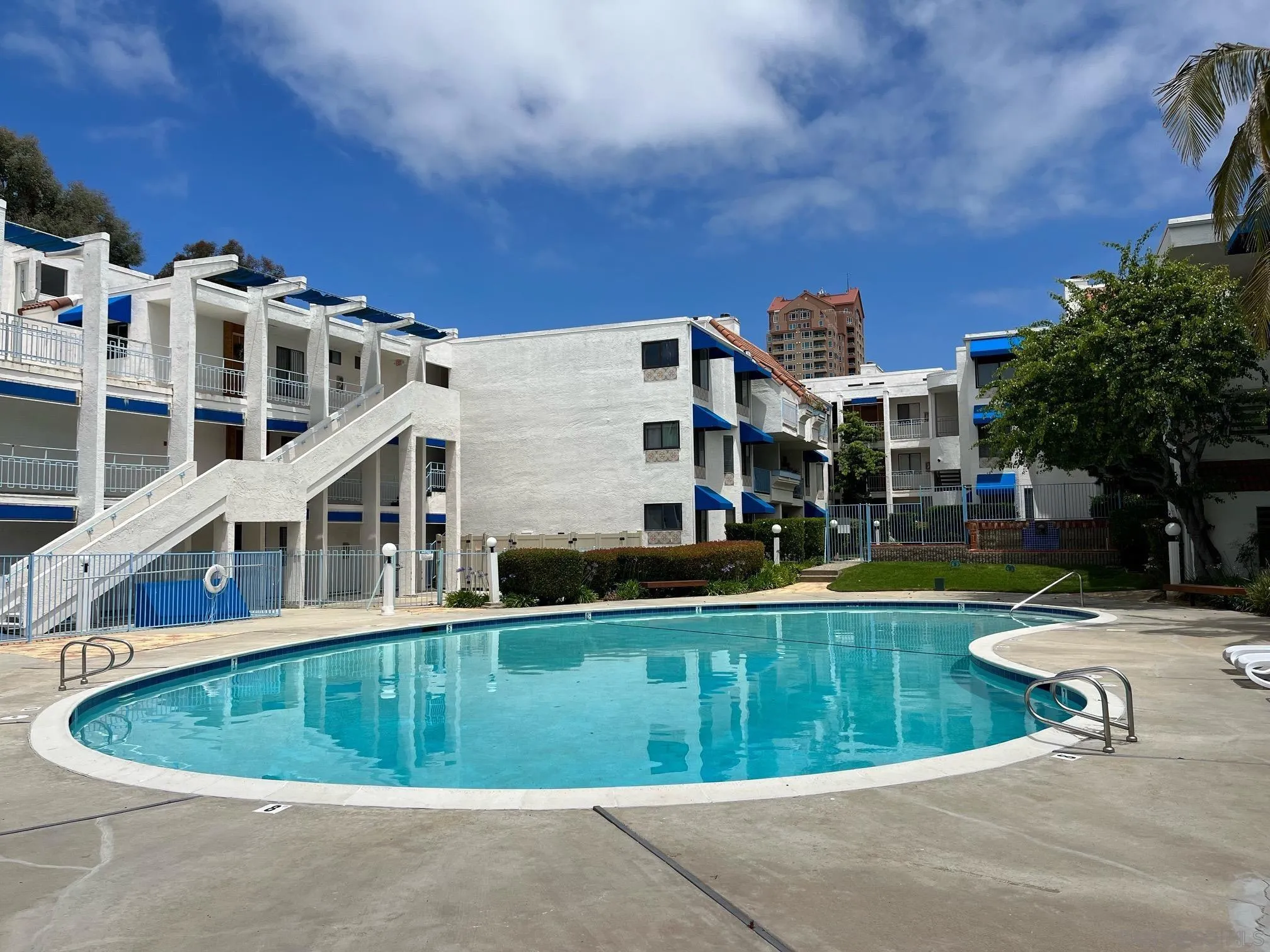 8332 Regents Road, Unit 1M San Diego, CA 92122 - Photo 1 of 18 a view of a building with a swimming pool