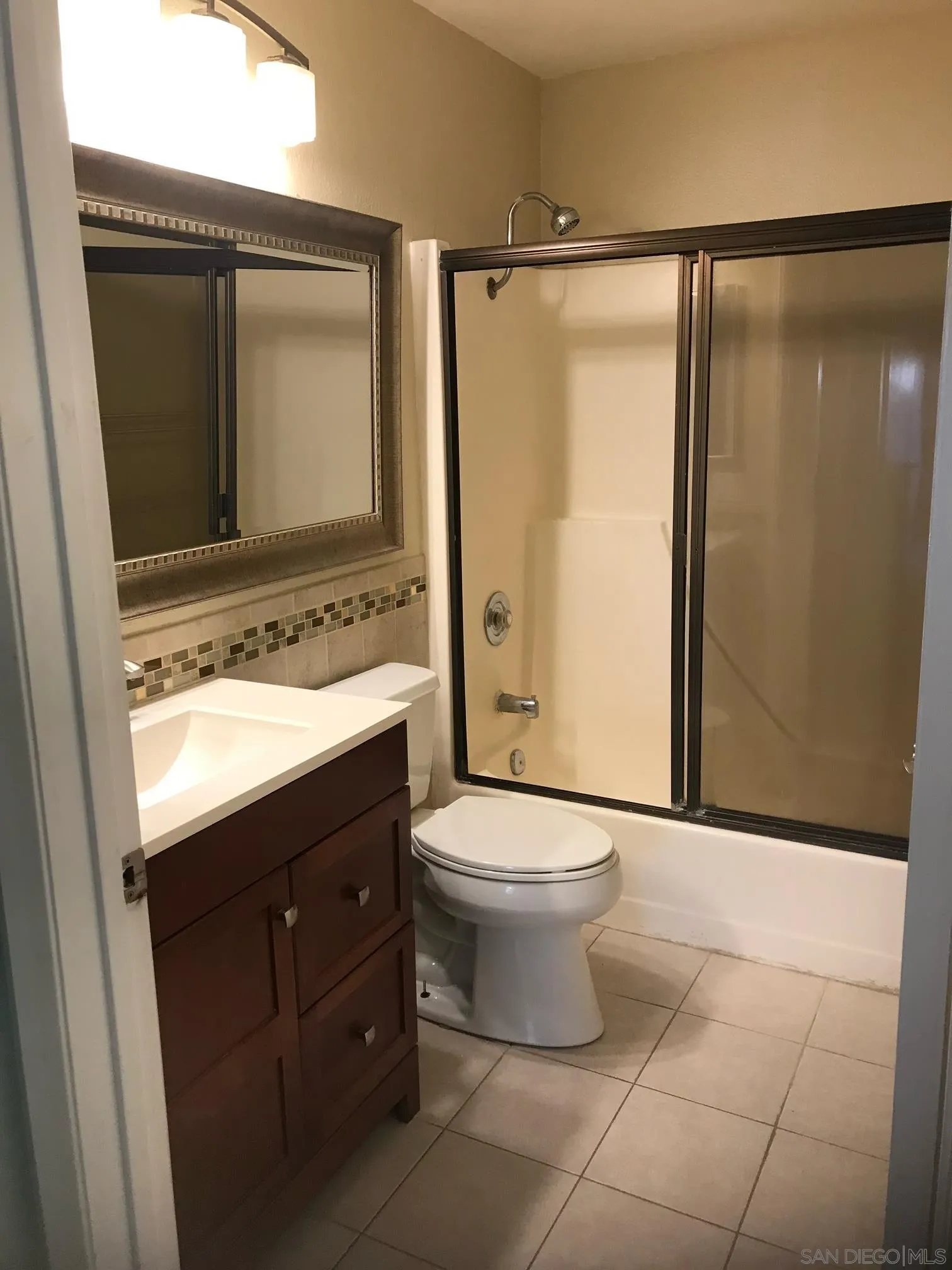 8332 Regents Road, Unit 1M San Diego, CA 92122 - Photo 13 of 18 a bathroom with a sink toilet and shower