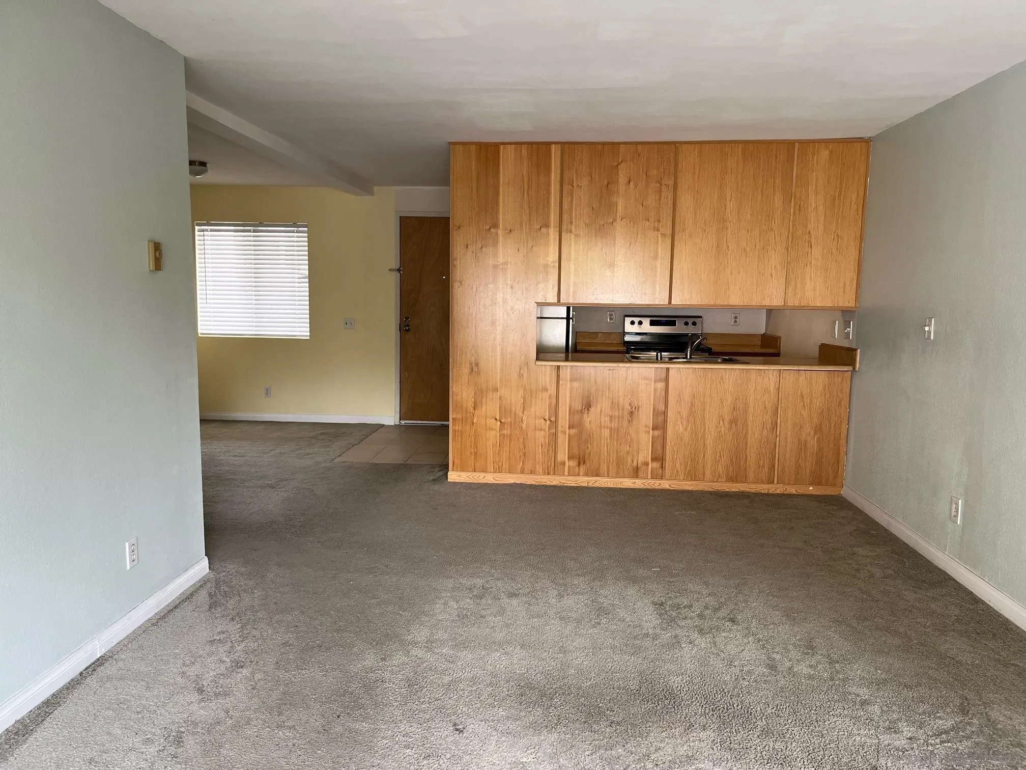 8332 Regents Road, Unit 1M San Diego, CA 92122 - Photo 3 of 18 a view of a room with furniture and a window
