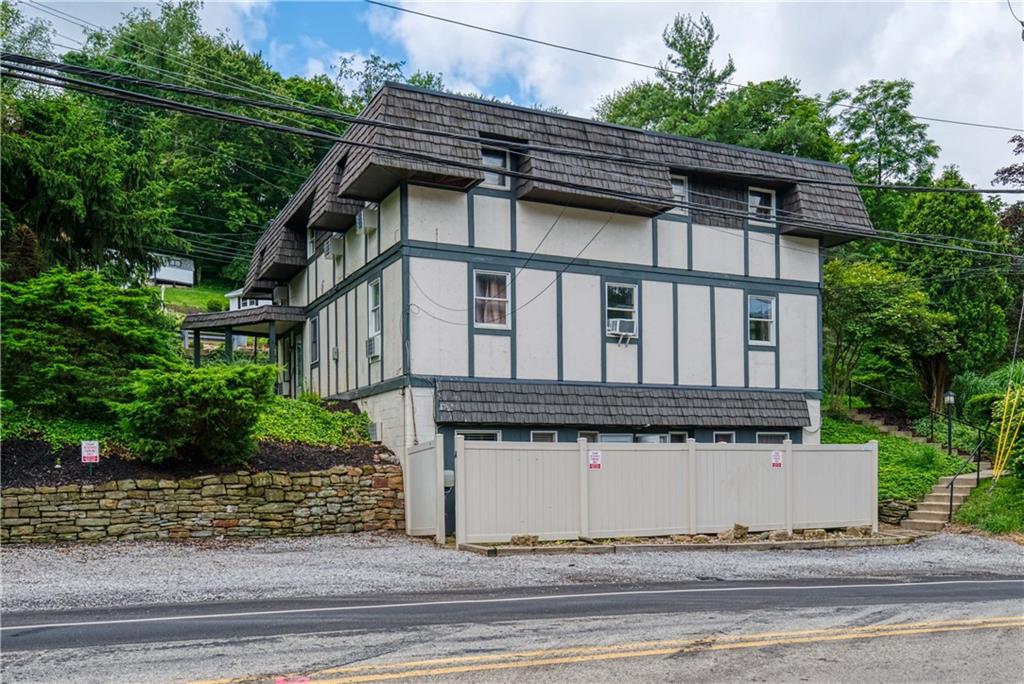 2807 Middle Road Glenshaw, PA 15116 - Photo 4 of 34 front view of a house with a bench