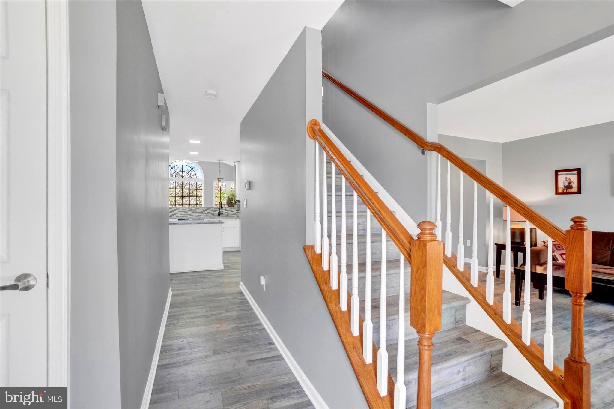 2512 Codorus Lane Spring Grove, PA 17362 - Photo 14 of 42 a view of a hallway with wooden floor and staircase