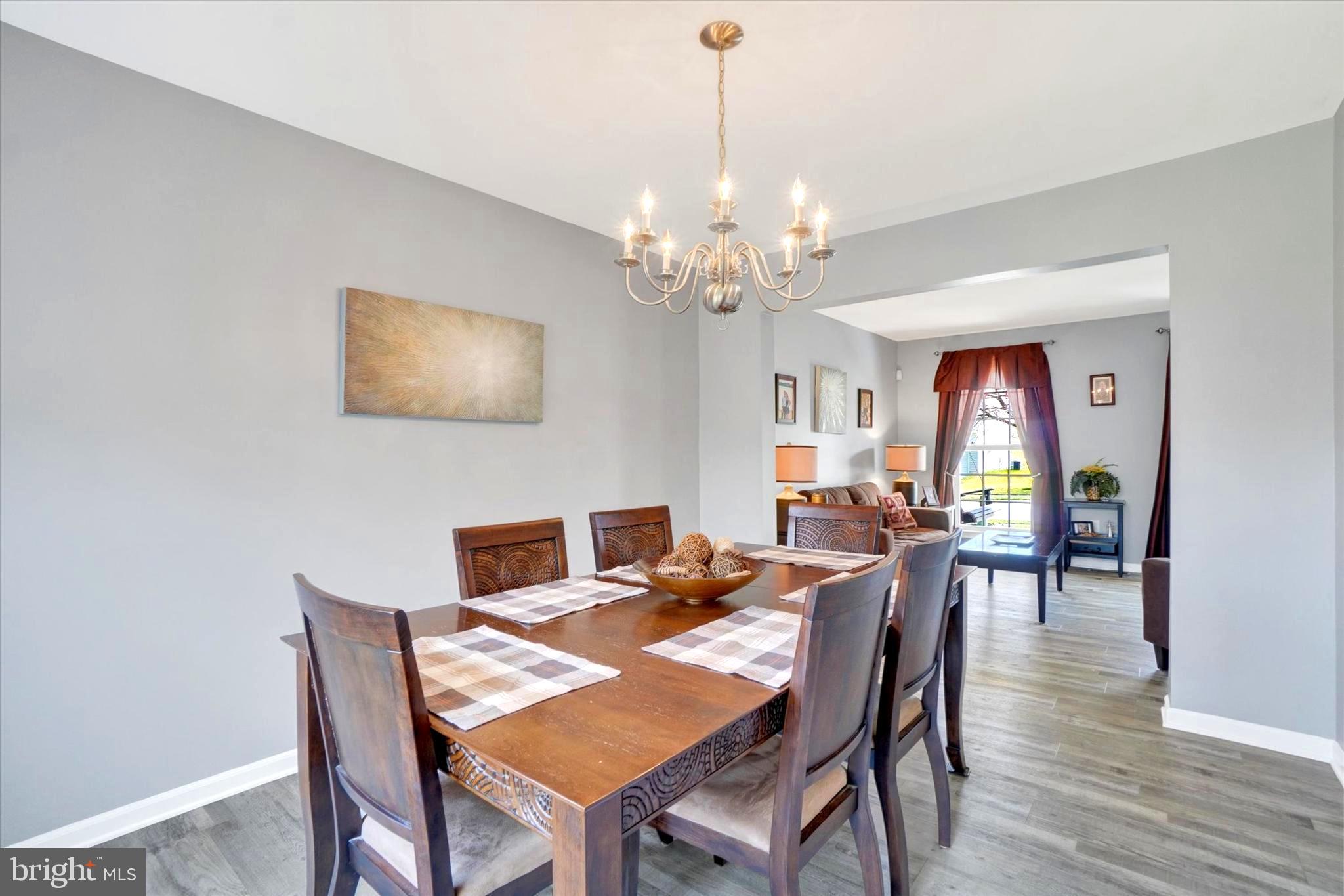 2512 Codorus Lane Spring Grove, PA 17362 - Photo 17 of 42 a view of a dining room with furniture wooden floor and chandelier