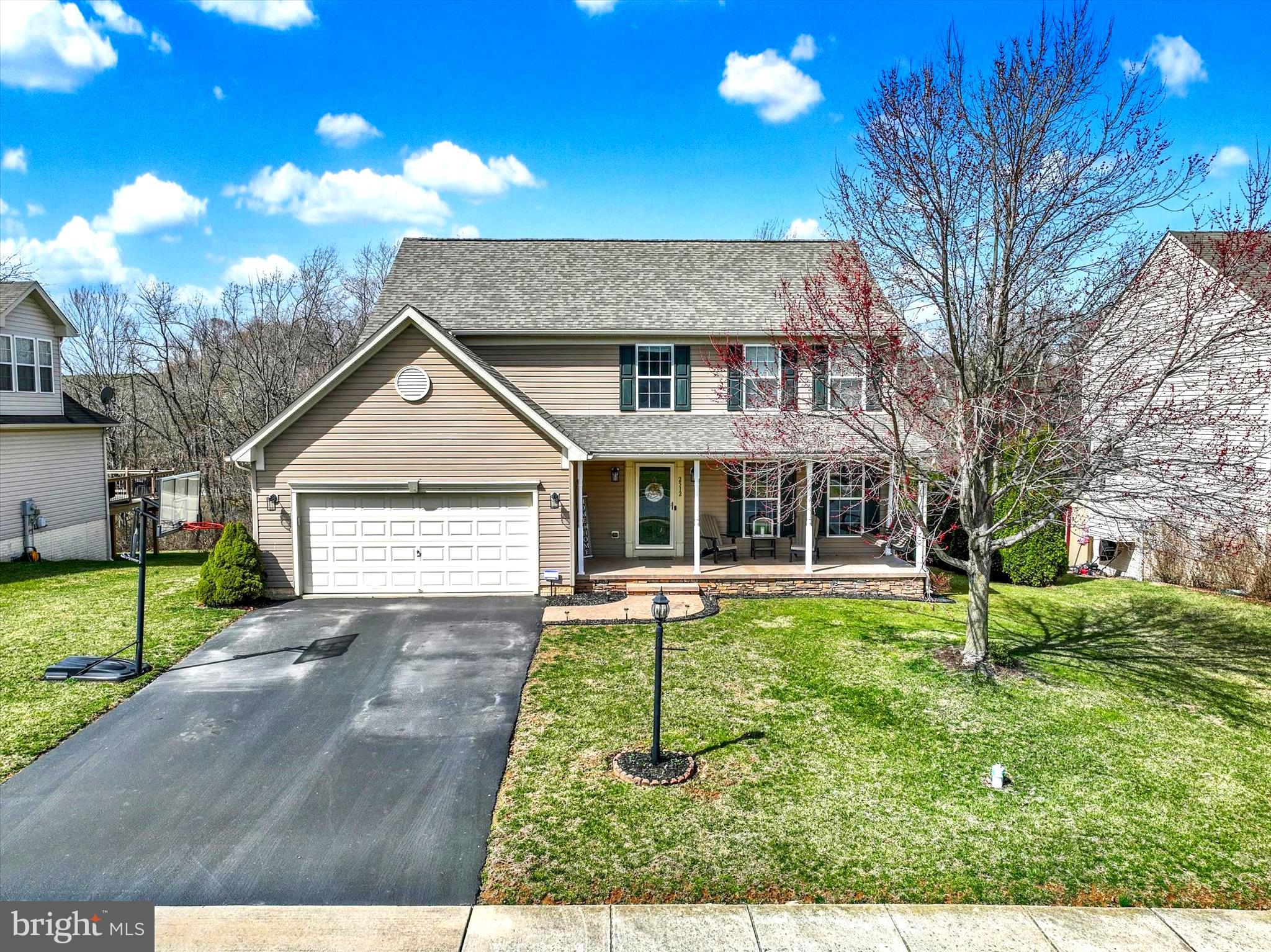 2512 Codorus Lane Spring Grove, PA 17362 - Photo 2 of 42 a front view of a house with a yard