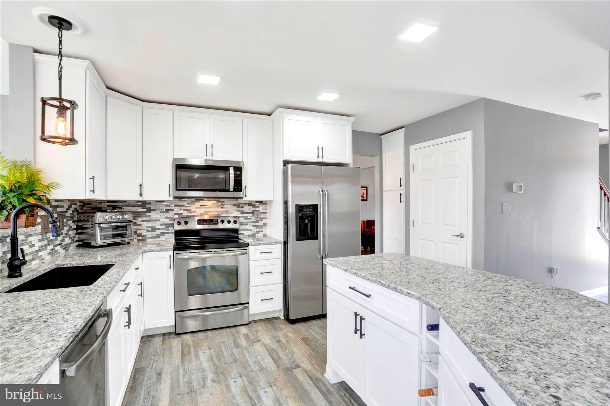2512 Codorus Lane Spring Grove, PA 17362 - Photo 21 of 42 a kitchen with a sink stove and refrigerator