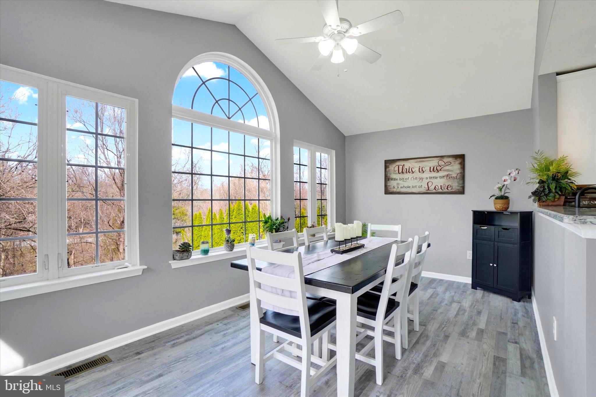 2512 Codorus Lane Spring Grove, PA 17362 - Photo 22 of 42 a view of a dining room with furniture a chandelier and wooden floor