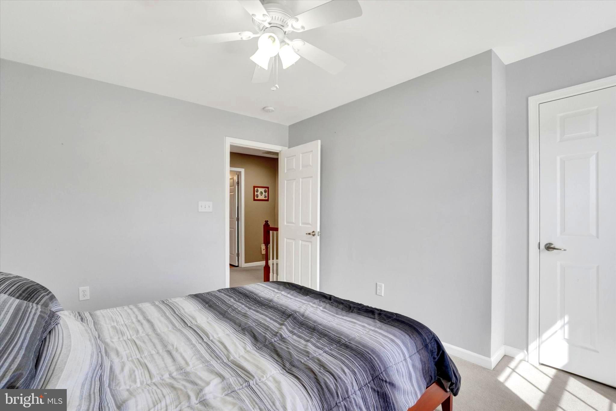 2512 Codorus Lane Spring Grove, PA 17362 - Photo 32 of 42 a bedroom with a bed and a chandelier