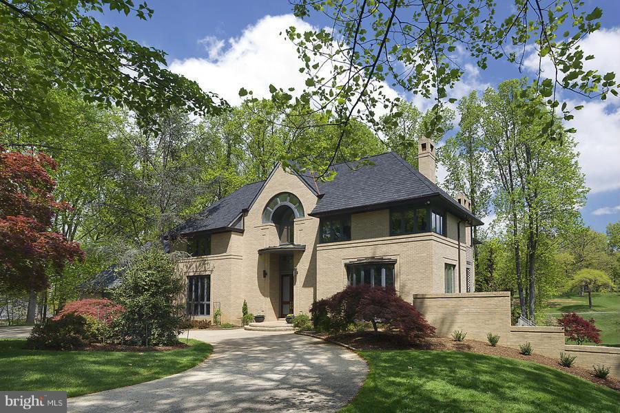 10831 Lockland Road Potomac, MD 20854 - Photo 1 of 16 a front view of a house with a yard and garage