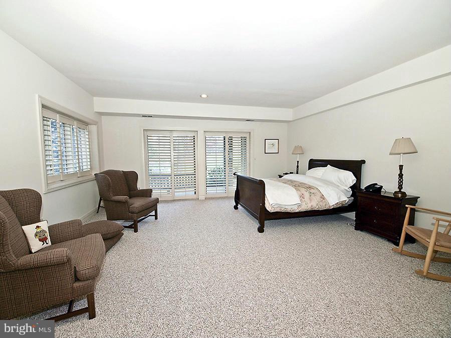 10831 Lockland Road Potomac, MD 20854 - Photo 12 of 16 a bedroom with bed couch and window