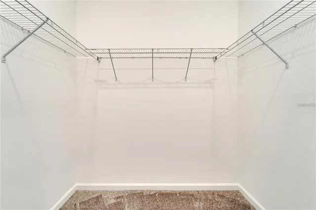 a bathroom with a bathtub shower sink vanity and mirror