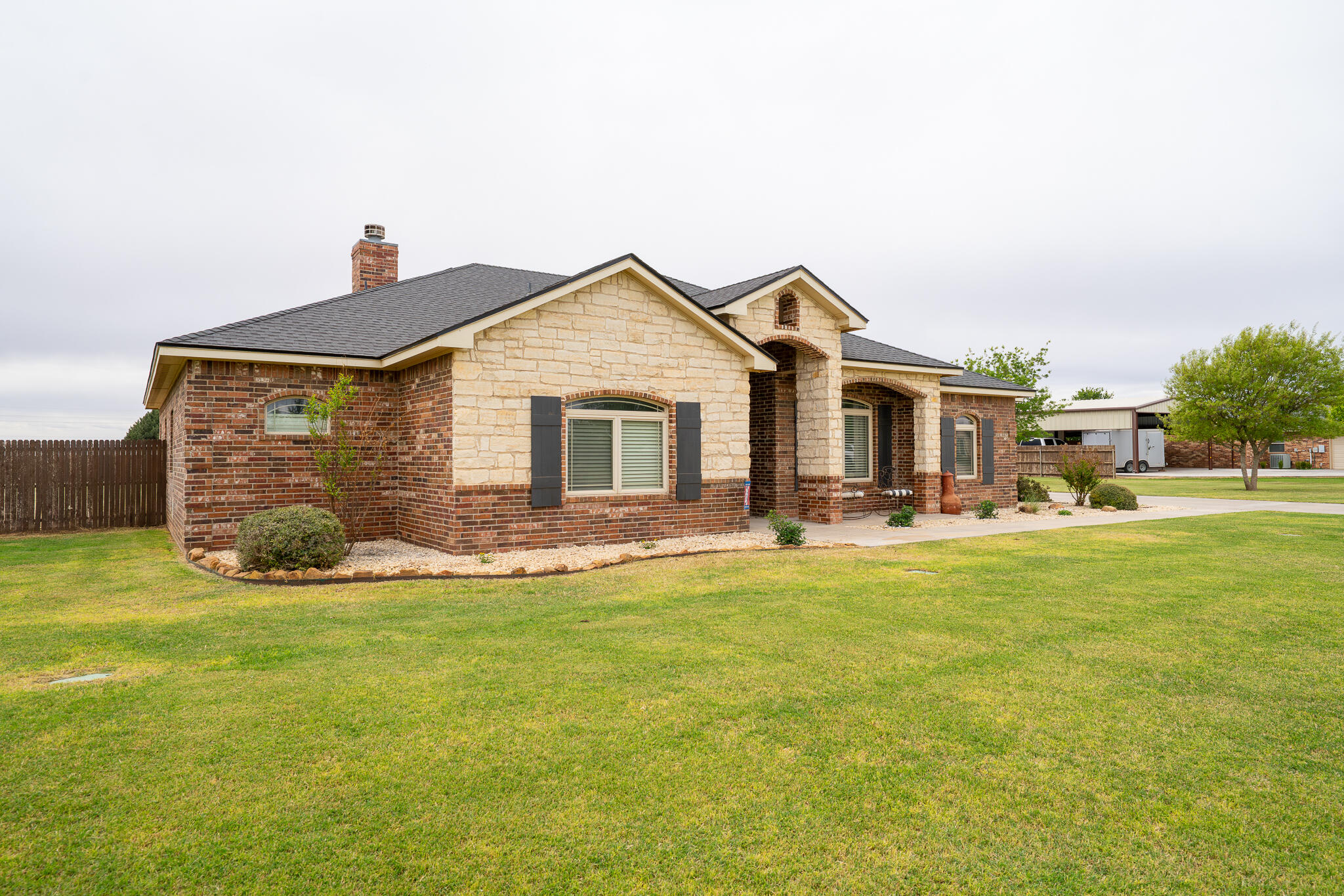 3301 County Road 7560 Lubbock, TX 79423 - Photo 3 of 40 a front view of house with yard and seating area