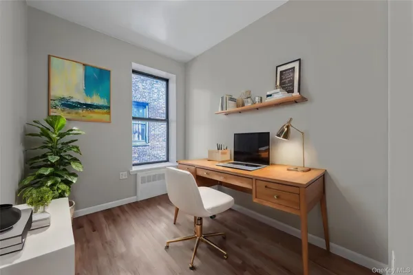 a workspace with furniture and window