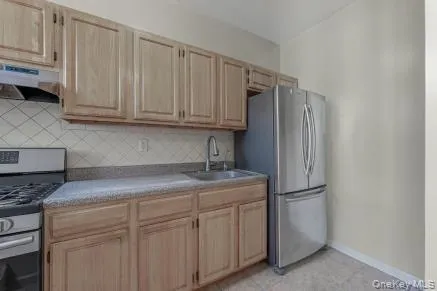 a kitchen with appliances cabinets and a counter top space