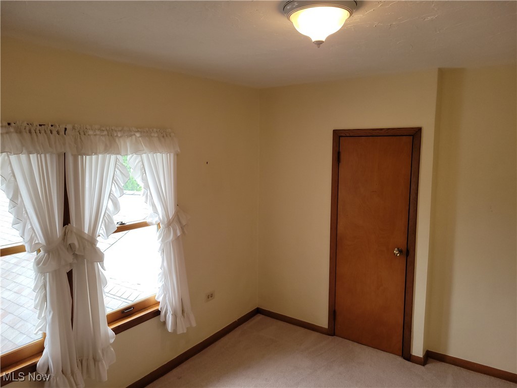 29119 Edgewood Road Bay Village, OH 44140 - Photo 30 of 40 Spare room featuring light carpet and baseboards