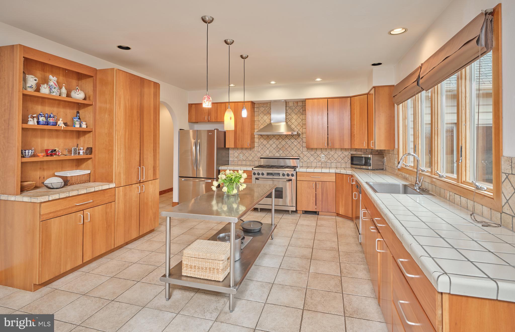 810 Callowhill Road Perkasie, PA 18944 - Photo 11 of 36 a large kitchen with kitchen island granite countertop a large counter top stainless steel appliances a sink and cabinets