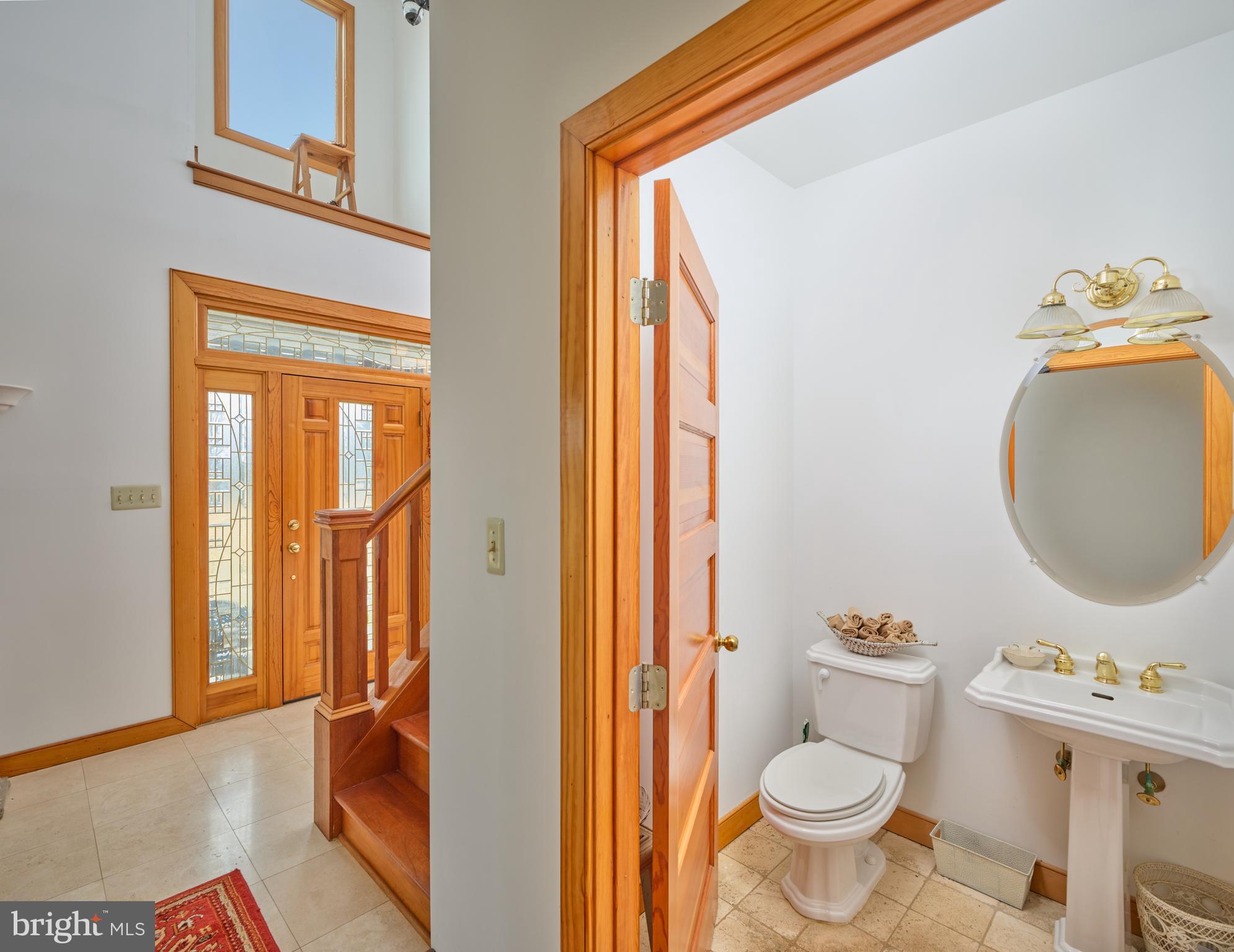810 Callowhill Road Perkasie, PA 18944 - Photo 9 of 36 a bathroom with a toilet a sink and a mirror