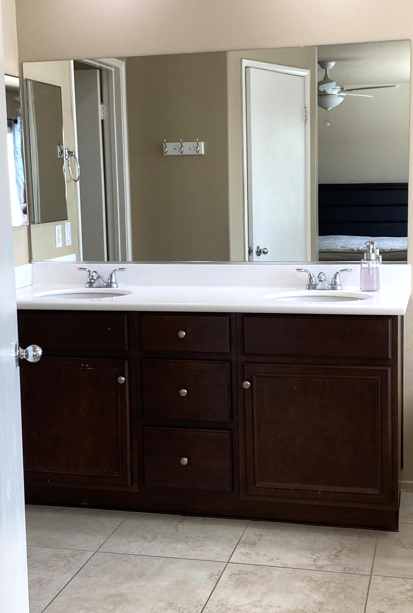 84175 Tramonto Way Indio, CA 92203 - Photo 12 of 22 a bathroom with a sink and a mirror