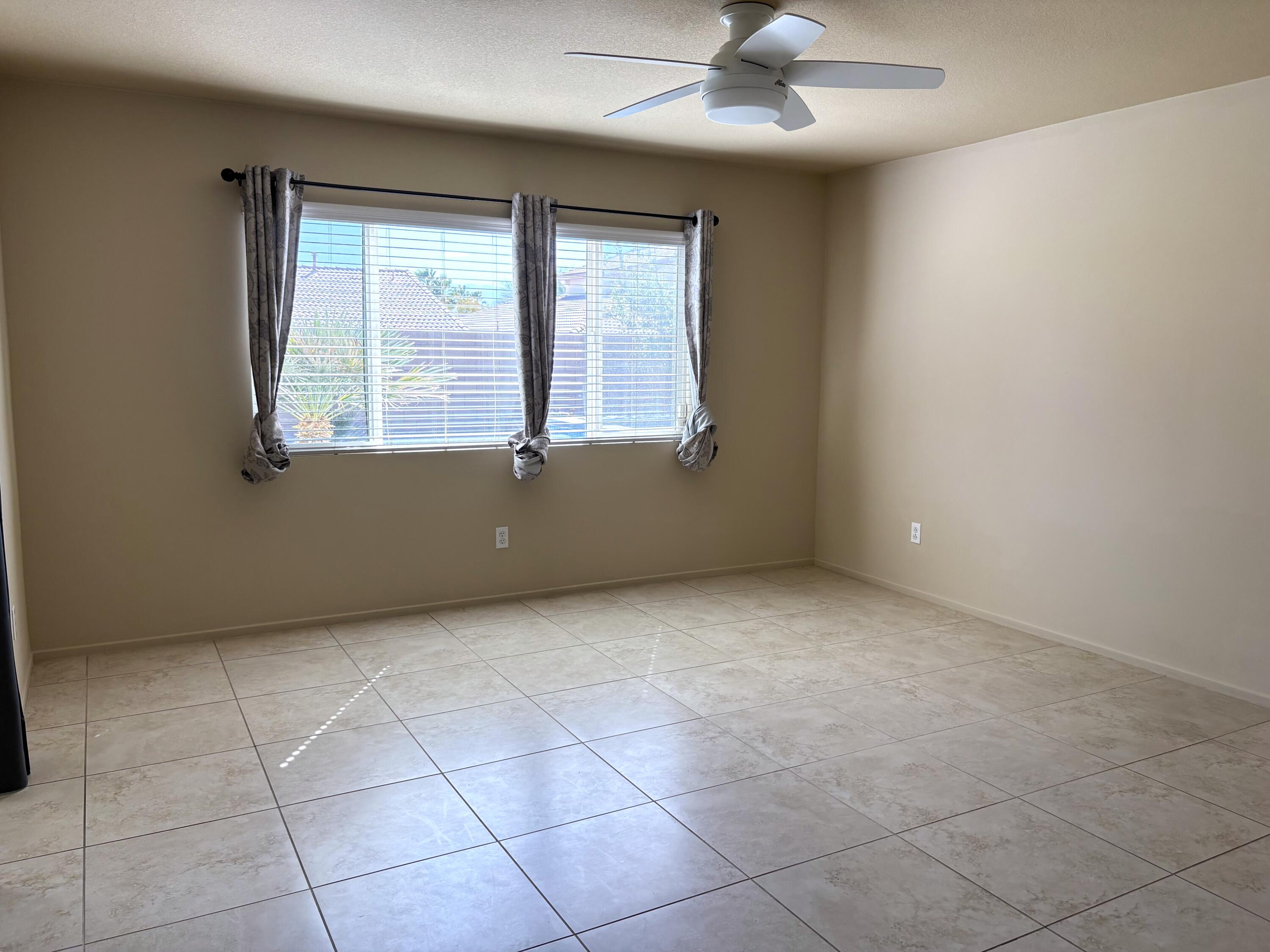 84175 Tramonto Way Indio, CA 92203 - Photo 13 of 22 a view of an empty room with a window