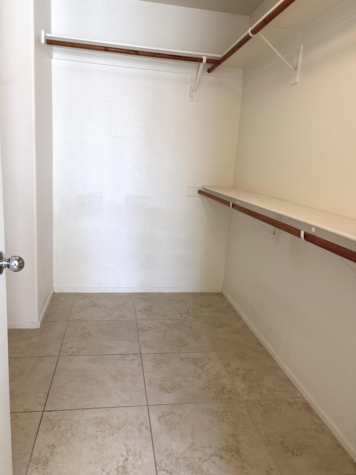 84175 Tramonto Way Indio, CA 92203 - Photo 14 of 22 a view of a room with an empty walk in closet