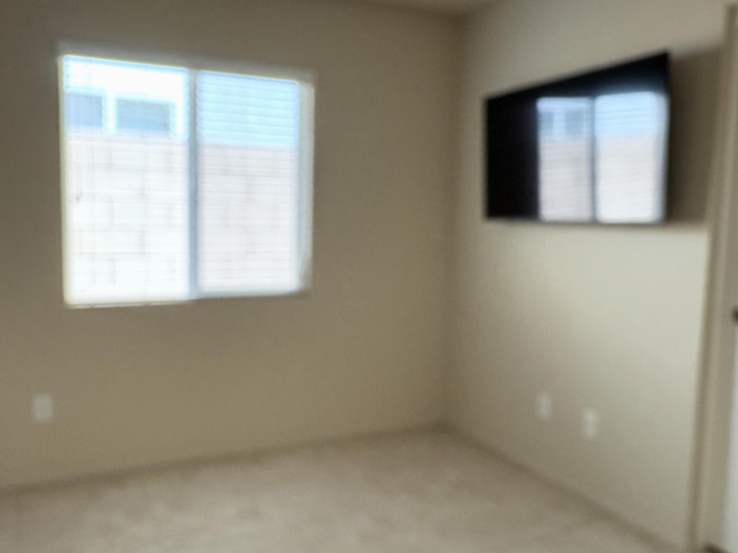 84175 Tramonto Way Indio, CA 92203 - Photo 20 of 22 an empty room with a window