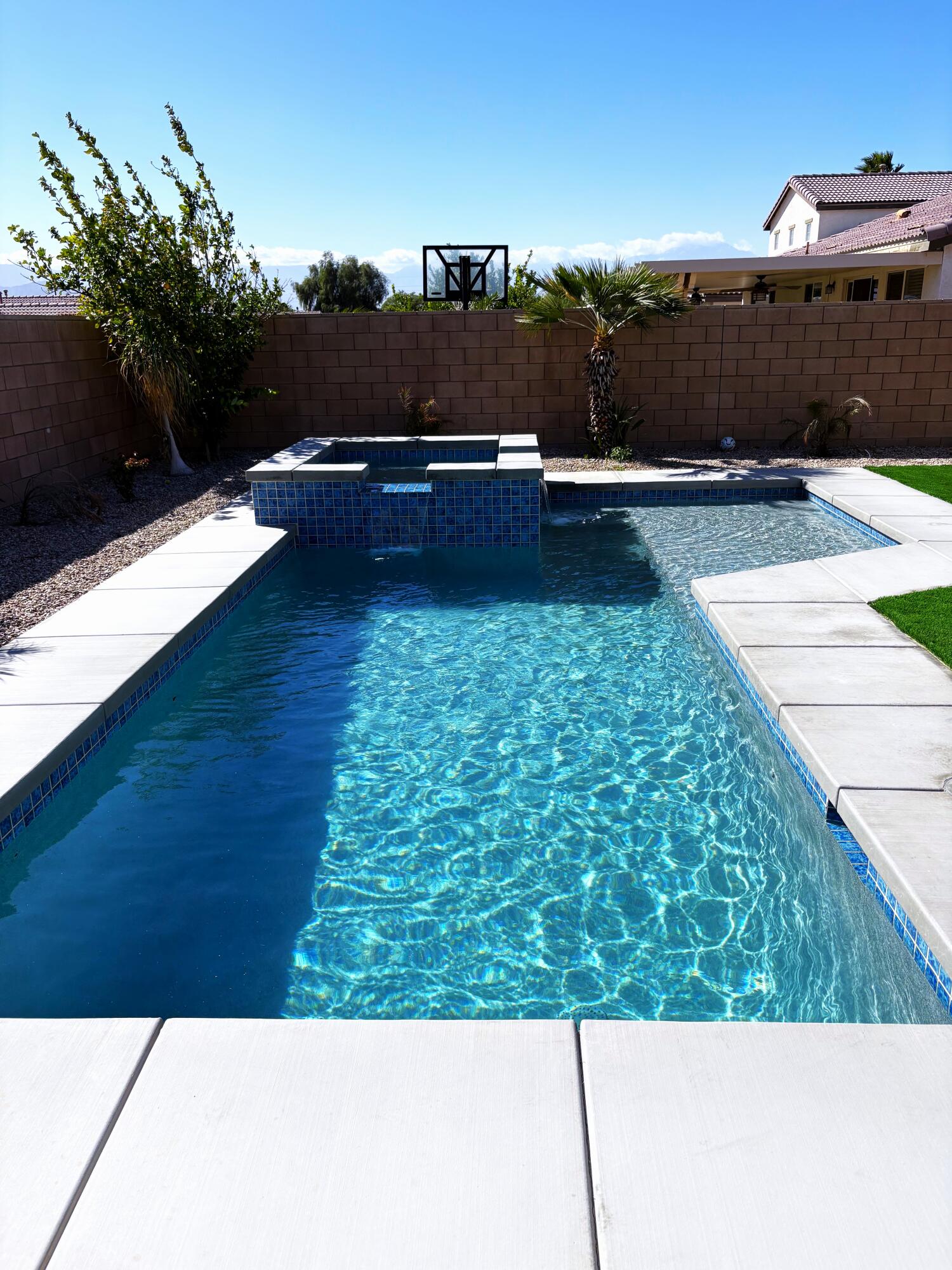 84175 Tramonto Way Indio, CA 92203 - Photo 2 of 22 a view of a swimming pool with a yard