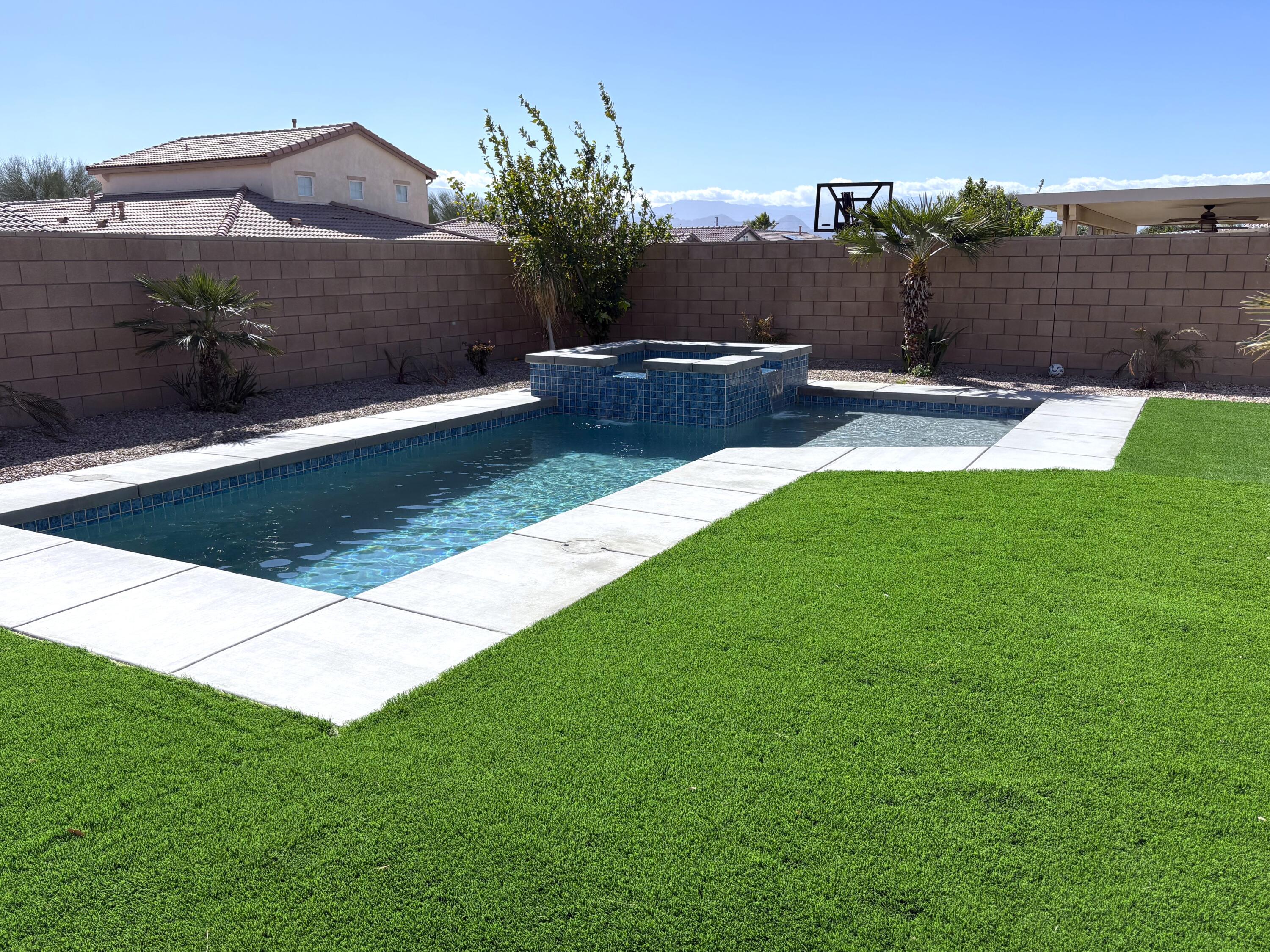 84175 Tramonto Way Indio, CA 92203 - Photo 3 of 22 a view of a garden with a bench