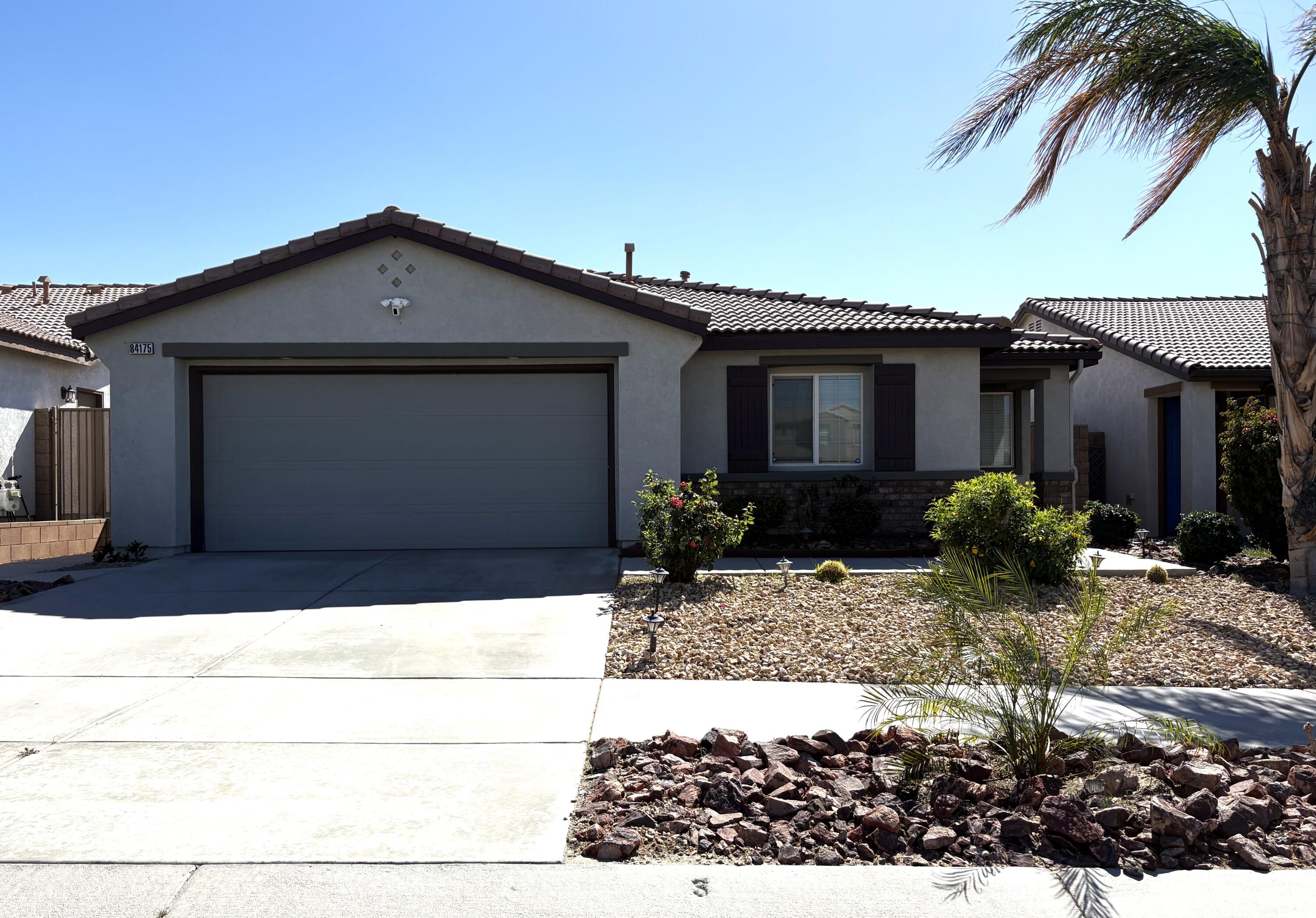84175 Tramonto Way Indio, CA 92203 - Photo 4 of 22 a view of a house with a patio