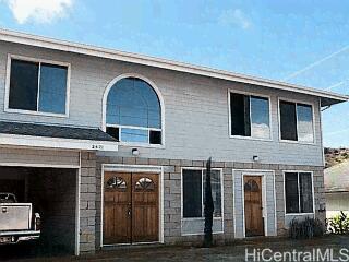 a front view of a house with glass windows
