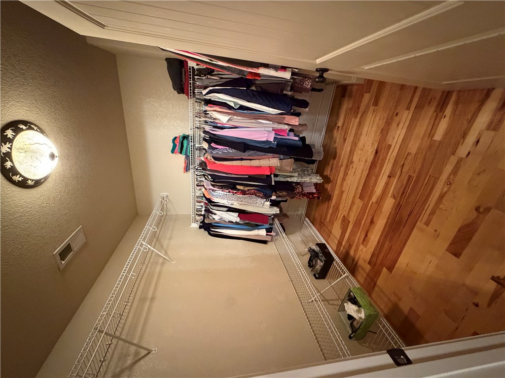 232 Hunters Trail Walhalla, SC 29691 - Photo 18 of 38 This spacious closet features both carpet and hardwood flooring, offering versatile storage solutions.