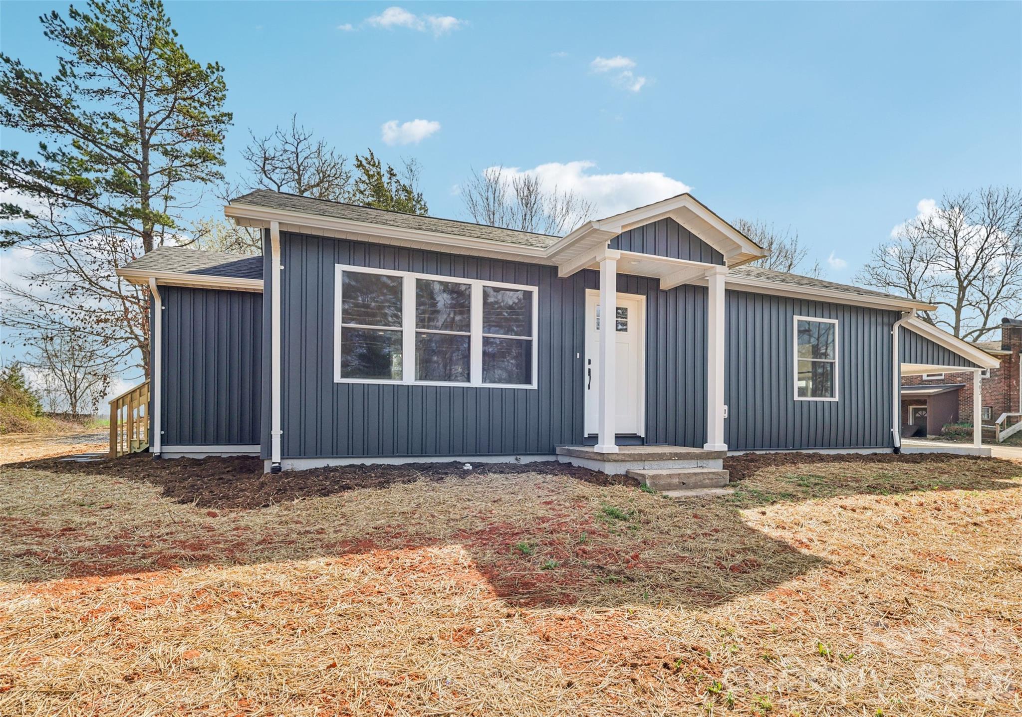 1403 Dudley Shoals Road Granite Falls, NC 28630 - Photo 1 of 20 a front view of a house with a yard