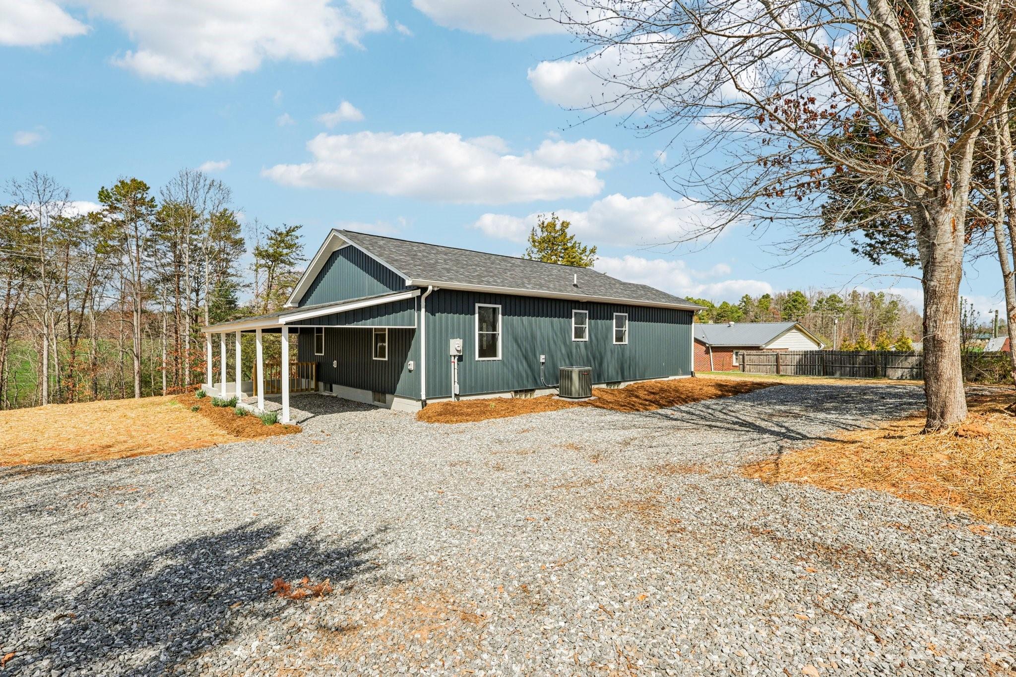 1403 Dudley Shoals Road Granite Falls, NC 28630 - Photo 14 of 20 a view of a house with snow on the road