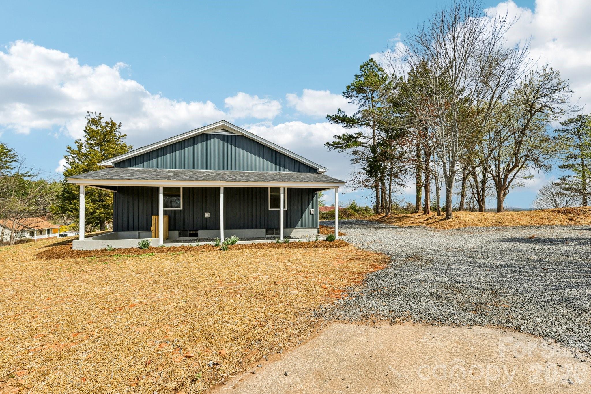 1403 Dudley Shoals Road Granite Falls, NC 28630 - Photo 15 of 20 a front view of a house with a yard