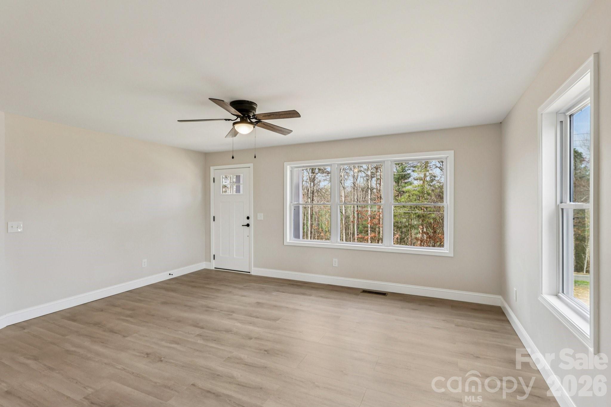 1403 Dudley Shoals Road Granite Falls, NC 28630 - Photo 7 of 20 a view of an empty room with a window