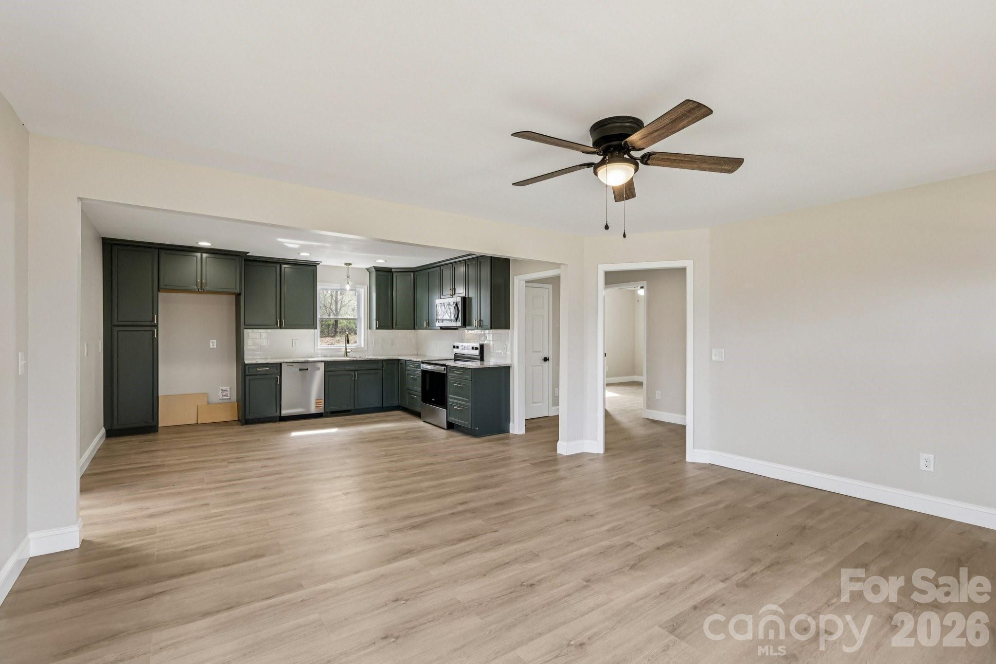 1403 Dudley Shoals Road Granite Falls, NC 28630 - Photo 8 of 20 a view of a kitchen with a sink and cabinet