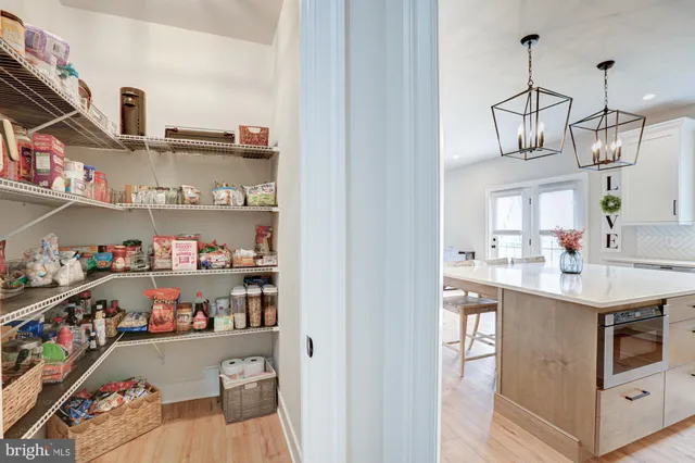a bedroom with a bed and a ceiling fan