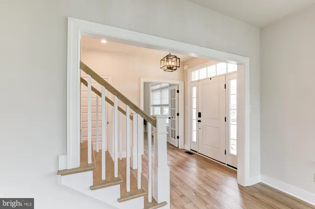 a view of a livingroom with workspace and a window