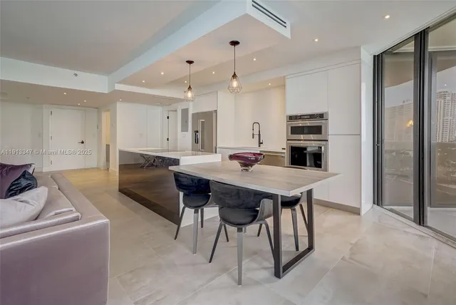 a view of kitchen with cabinets and wooden floor