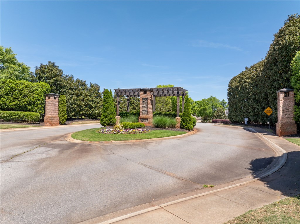 131 Loudwater Drive Anderson, SC 29621 - Photo 20 of 20 This inviting entrance features a beautifully landscaped roundabout, welcoming residents and guests alike.