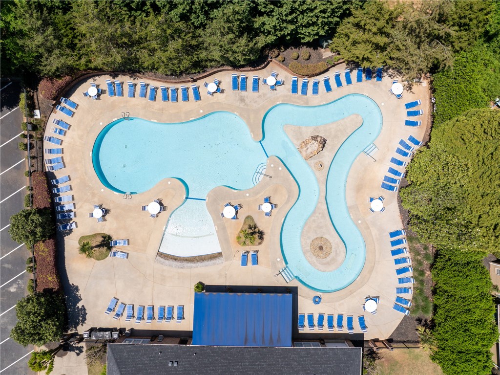 131 Loudwater Drive Anderson, SC 29621 - Photo 8 of 20 An aerial view reveals an expansive pool complex with a winding lazy river and ample lounging space.