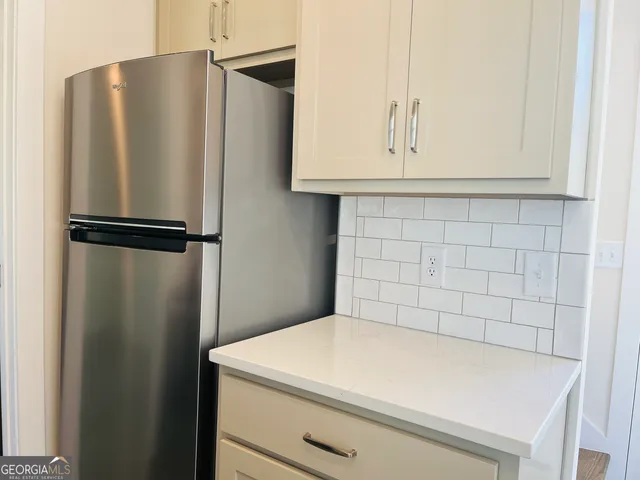 a white refrigerator freezer sitting in a kitchen