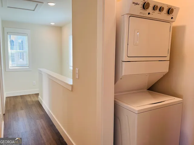 an empty room with wooden floor and closet