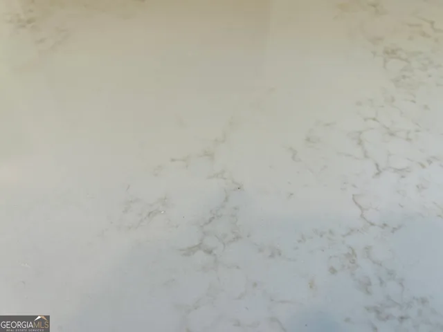 a close up of a white marble wall