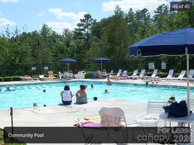 4167 Greenview Court Fort Mill, SC 29708 - Photo 16 of 16 a view of a swimming pool and lounge chairs in patio