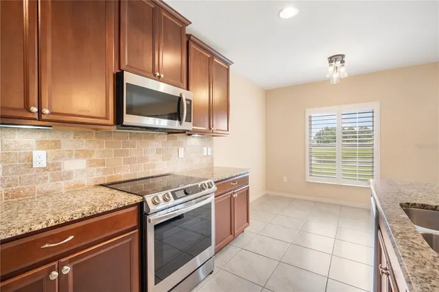 a kitchen with a stove and a microwave