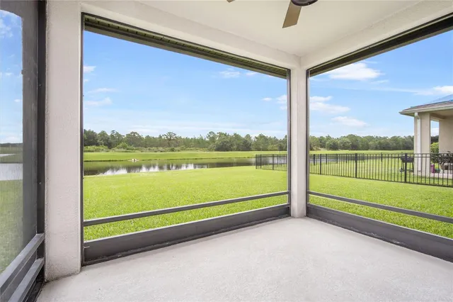 a view of a lake with houses in the back