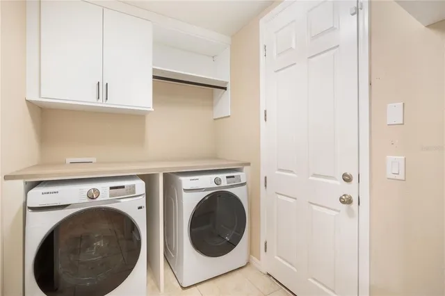 a utility room with dryer and washer