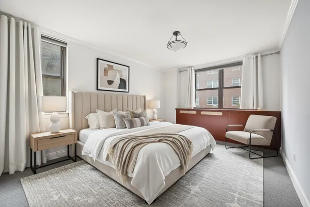 a bedroom with a bed and a couch