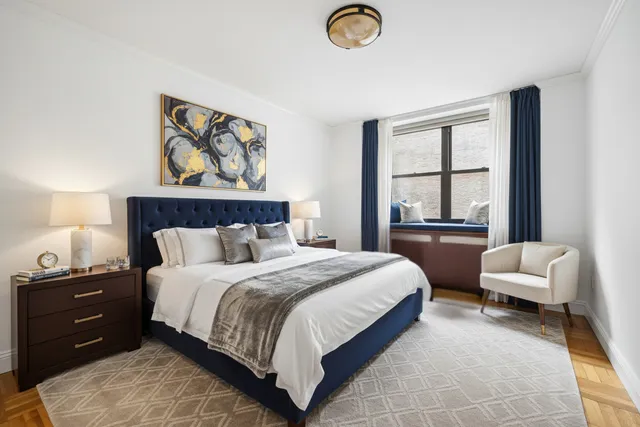 a bedroom with a bed and a couch