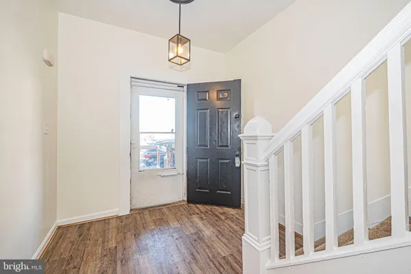 a view of entryway with wooden floor
